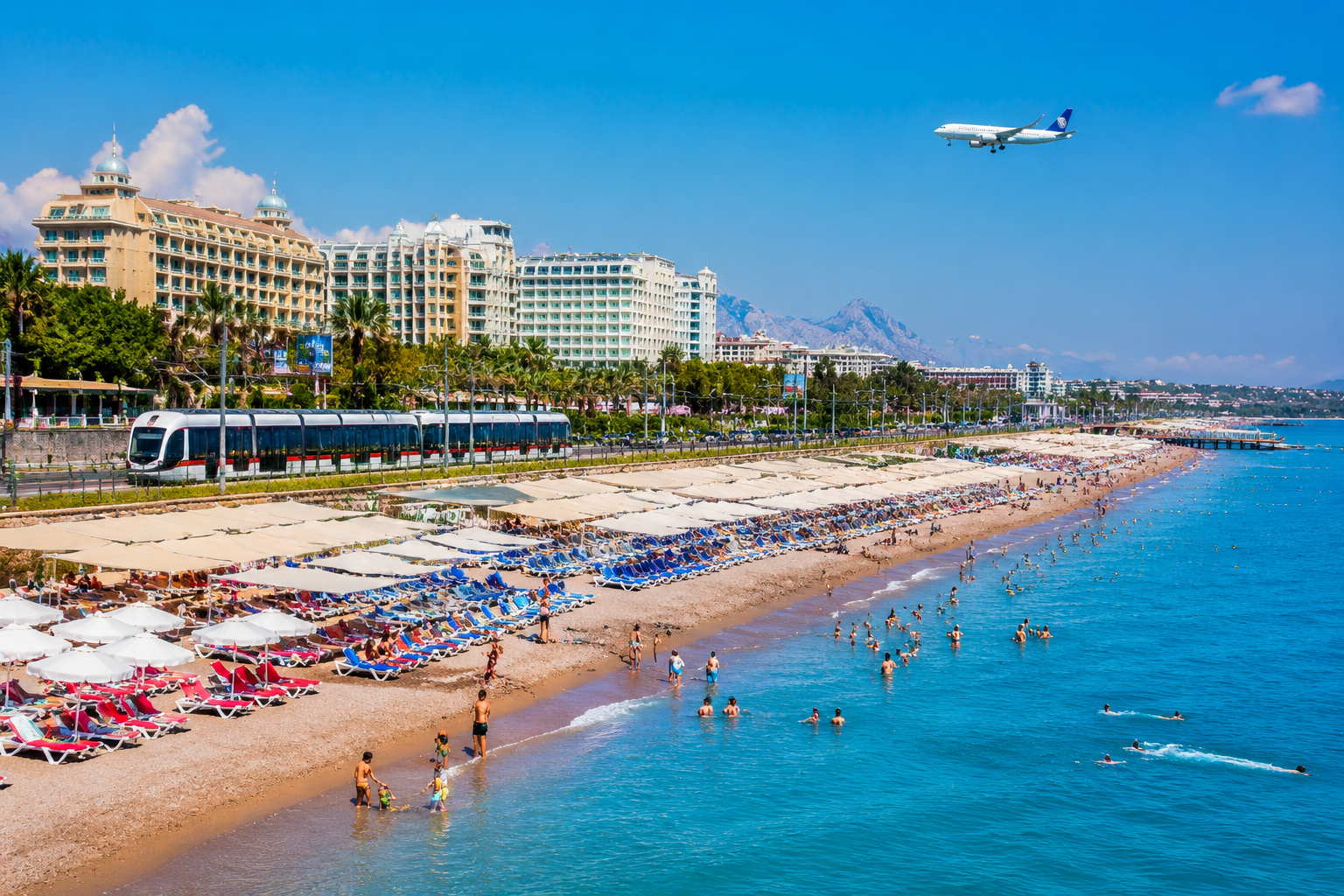 Turkey’s 2026 Coastal Showdown: Antalya vs. Bodrum vs. Fethiye for First-Time Beach Travelers 1 Detailed () editorial photograph of Antalya's Lara Beach coastline at midday with rows of colorful sunbeds, massive
