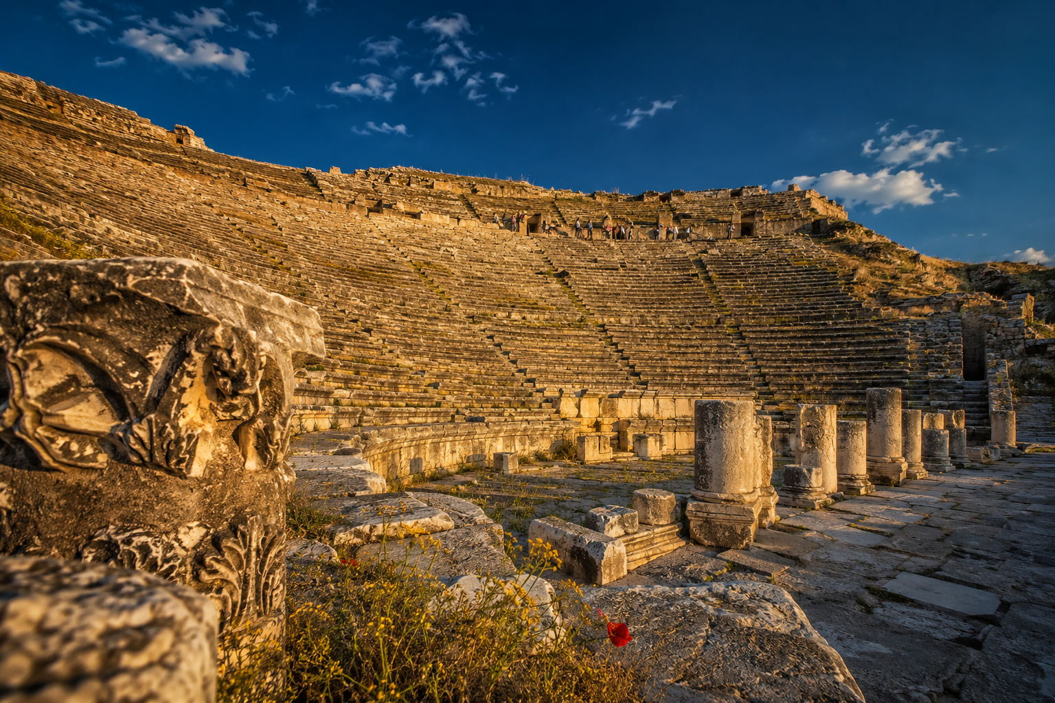 Pamukkale Cotton Castle Uncovered: Thermal Pools, Hierapolis Ruins, and 2026 Access Tips 2 () dramatic wide-angle photograph of the ancient Hierapolis Roman theater carved into hillside at Pamukkale, rows of